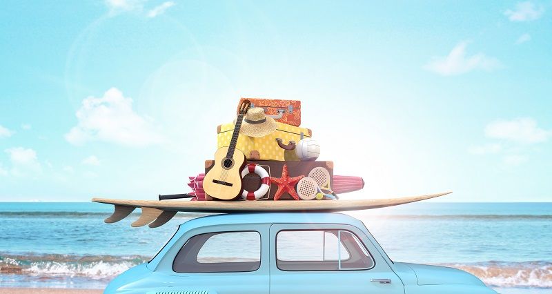 Car with luggage on the roof ready for summer vacation cm
