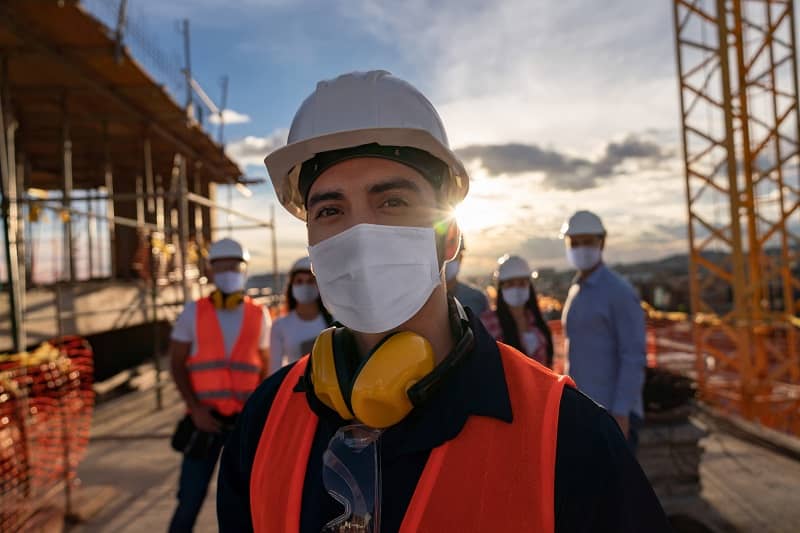 Portrait of a happy construction worker at a building site-cm