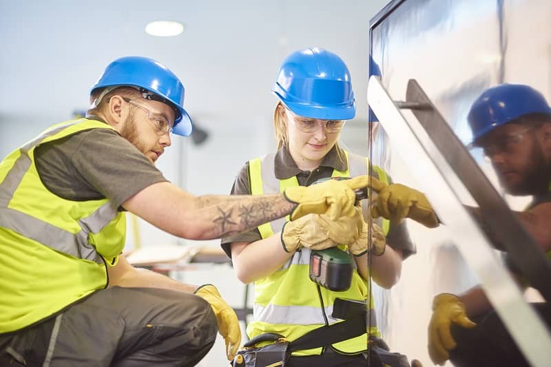 female construction apprentice and colleague-cm