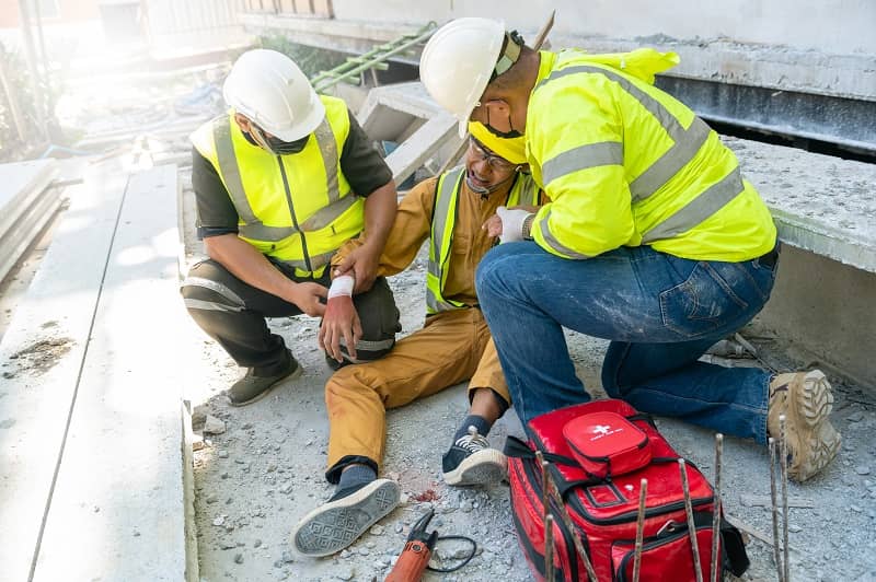First aid support employee accident in site work, Builder accident injury hand from working, Safety team help employee accident. First aid procedure.-cm